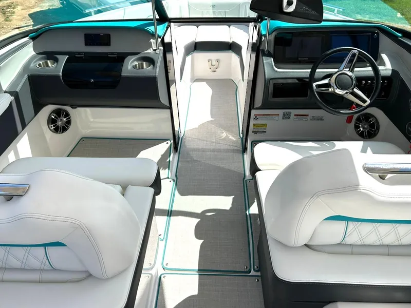 Slide: The Image of 2022 Regal LS4 Surf boat interior with modern dashboard and white seating. - 46