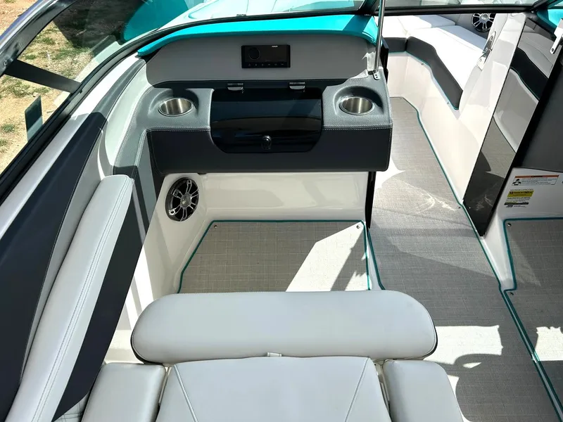 Slide: The Image of Interior of 2022 Regal LS4 Surf boat with modern seating and cup holders. - 47