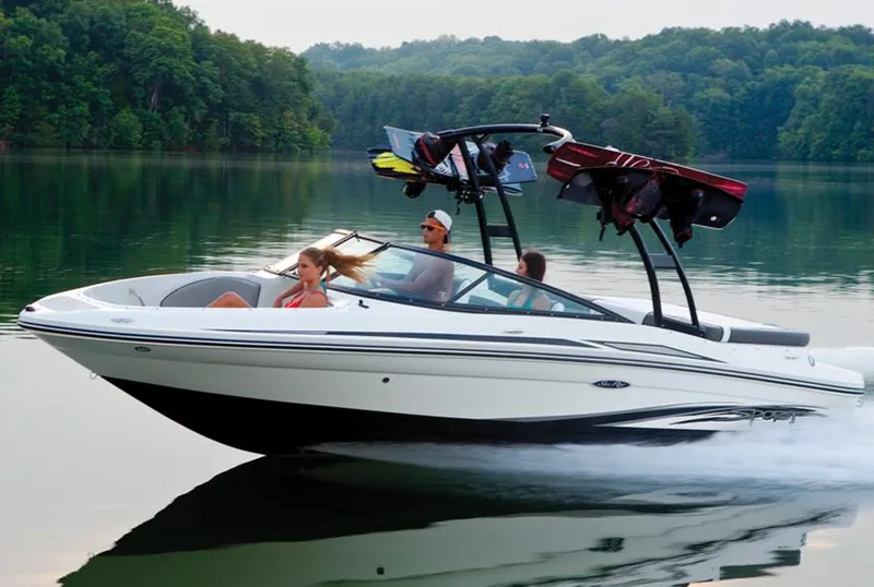 Slide: The Image of Manufacturer Provided Image: 2013 Sea Ray 205 Sport boat cruising on a lake with passengers. - 10