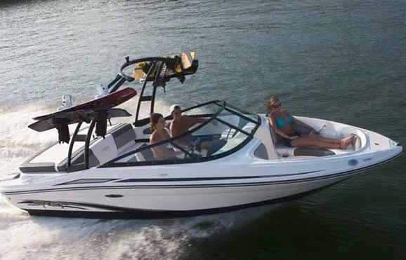Slide: The Image of Manufacturer Provided Image: 2013 Sea Ray 205 Sport boat cruising on water with passengers. - 11