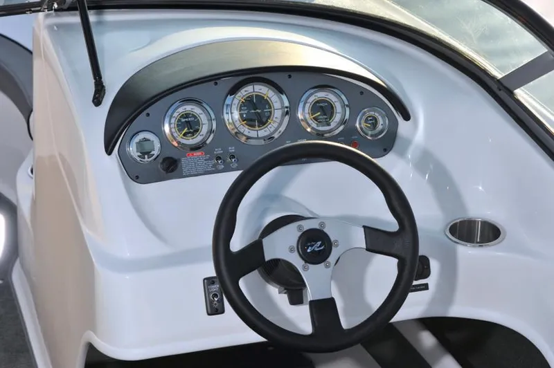 Slide: The Image of Manufacturer Provided Image: Steering console of a 2013 Sea Ray 205 Sport boat with gauges and controls. - 15