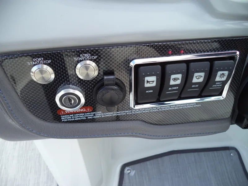 Slide: The Image of Control panel of 2017 Chaparral Vortex 223 VR boat with start/stop buttons and switches. - 12