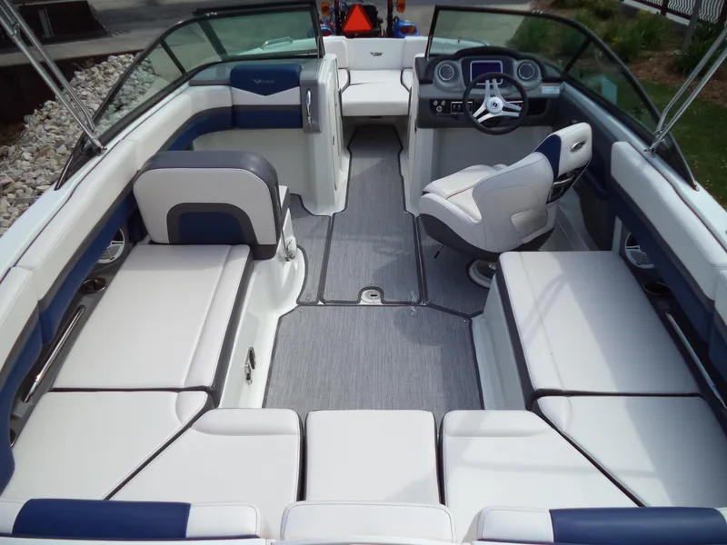 Slide: The Image of 2017 Chaparral Vortex 223 VR boat interior with white and blue seating. - 13