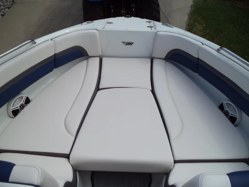 Slide: The Image of 2017 Chaparral Vortex 223 VR boat interior with white cushioned seating. - 15