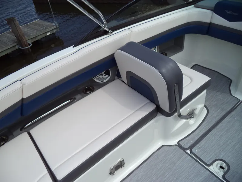 Slide: The Image of 2017 Chaparral Vortex 223 VR boat interior with cushioned seating and sleek design. - 17