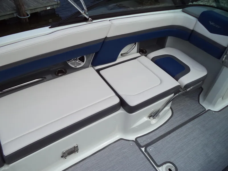Slide: The Image of 2017 Chaparral Vortex 223 VR boat interior seating with blue and white upholstery. - 18