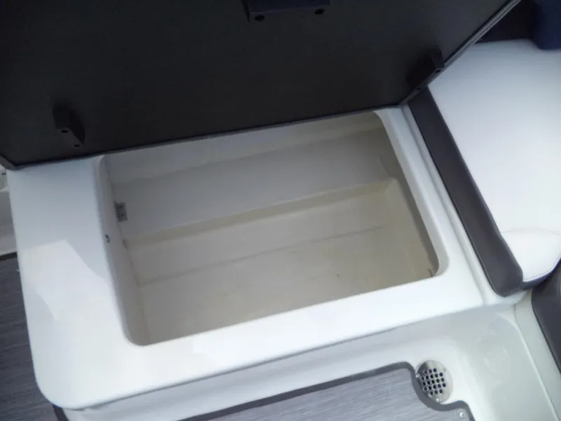 Slide: The Image of Open storage compartment in 2017 Chaparral Vortex 223 VR boat. - 21