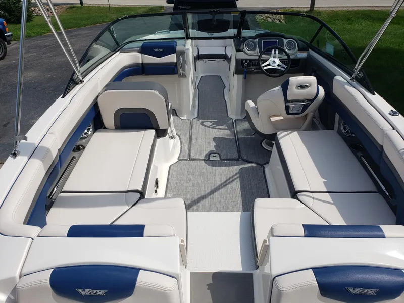 Slide: The Image of 2017 Chaparral Vortex 223 VR boat interior with plush seating and modern dashboard. - 7