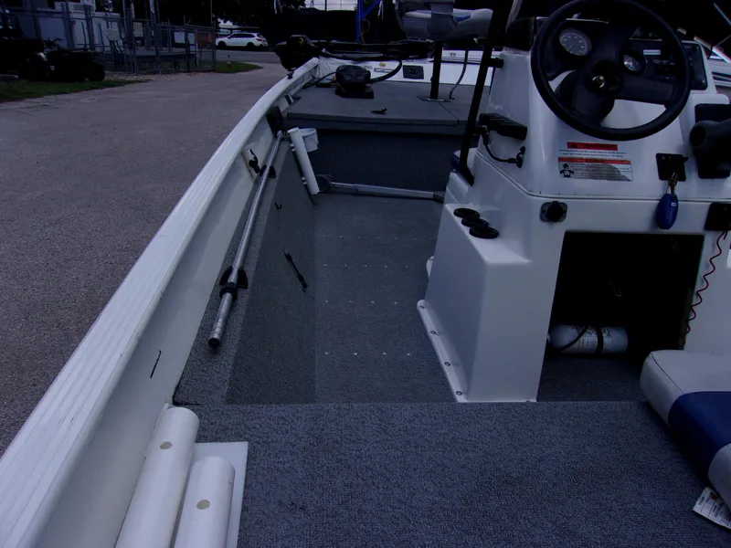 Slide: The Image of 2008 G3 1860 CC Deluxe boat interior with steering console and seating. - 5