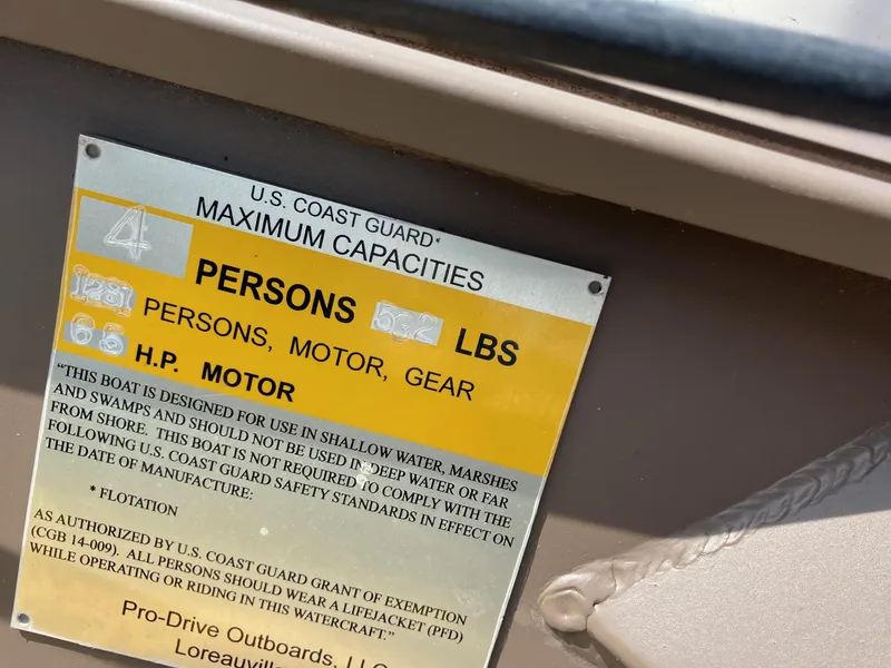 Slide: The Image of 2017 Pro-Drive SBX Series 18' boat capacity plate, showing maximum persons and weight limits. - 11