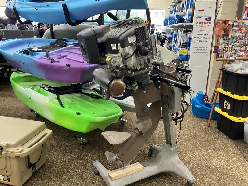 Slide: The Image of 2017 Pro-Drive SBX Series 18' motor displayed in a store with colorful kayaks. - 17