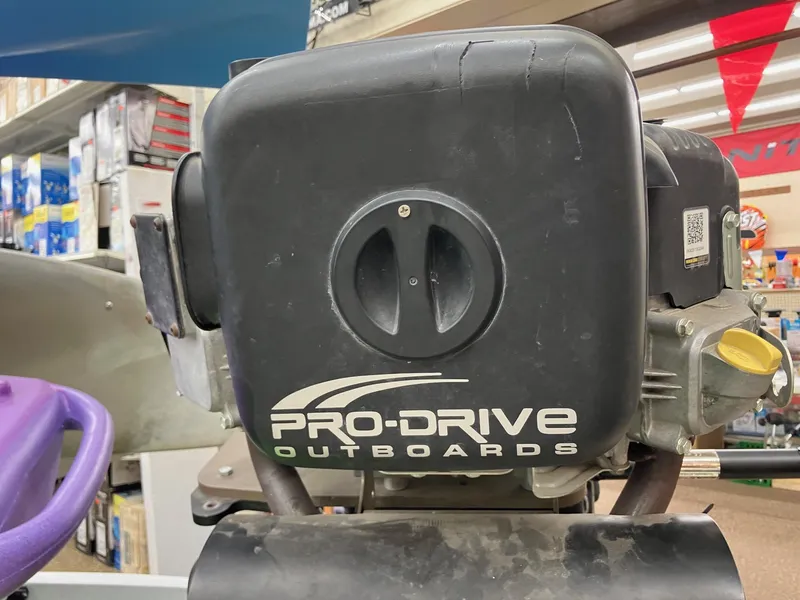 Slide: The Image of Pro-Drive Outboards engine, SBX Series 18', 2017 model, displayed in a store. - 18
