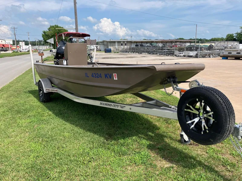 Slide: The Image of 2017 Pro-Drive SBX Series 18' boat on trailer, parked on grass. - 4