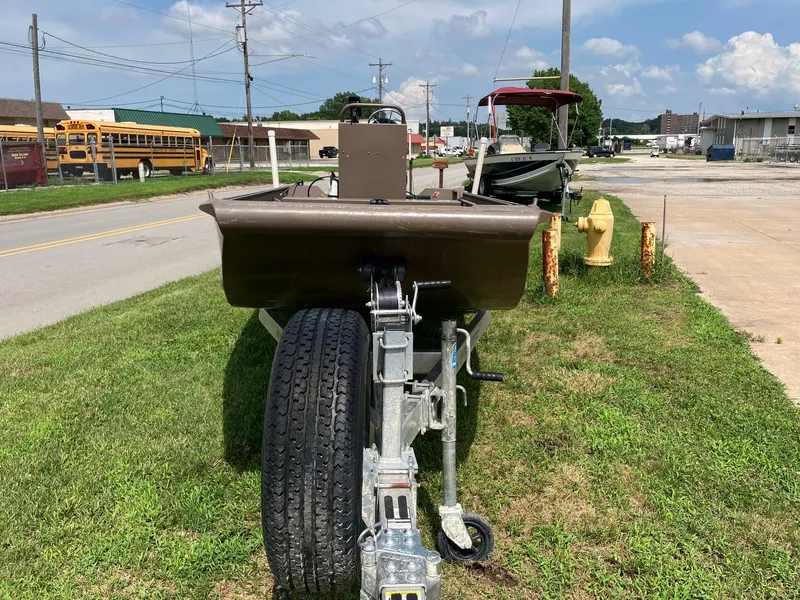 Slide: The Image of 2017 Pro-Drive SBX Series 18' boat on trailer, parked on grass beside a road. - 6
