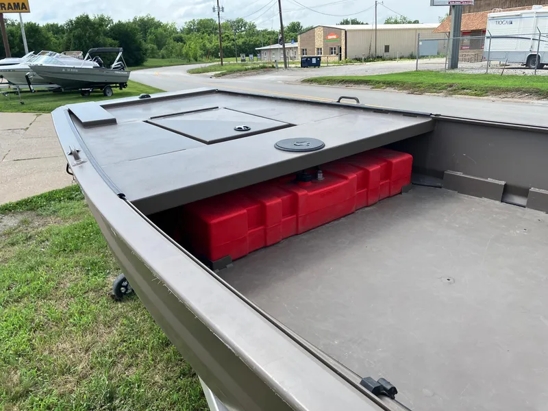 Slide: The Image of 2017 Pro-Drive SBX Series 18' boat with red storage compartment, parked outdoors. - 7