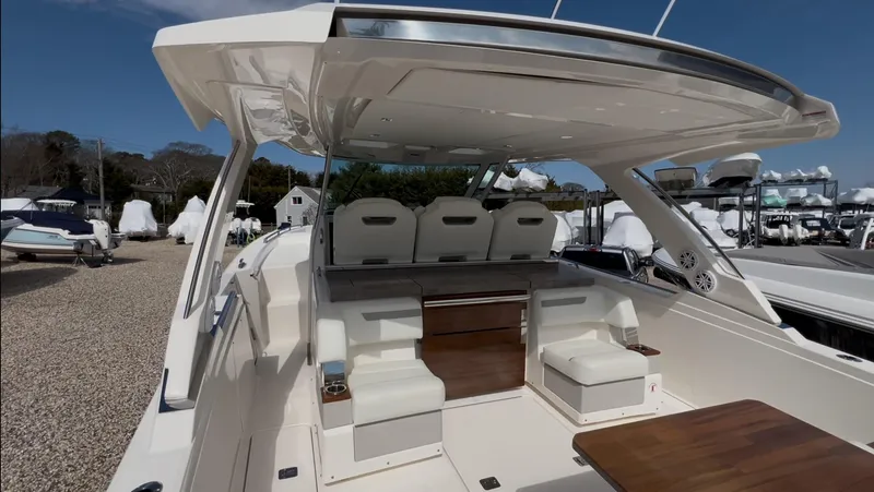 Slide: The Image of 2023 Tiara Yachts 38 LS interior with seating and table, showcasing luxury design. - 10
