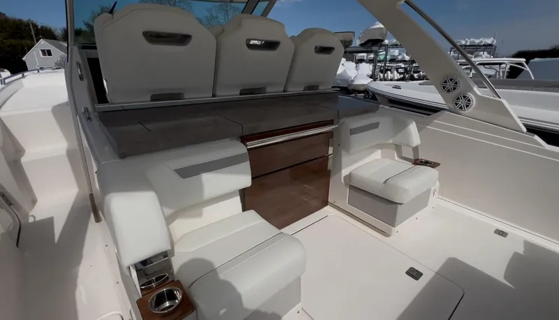 Slide: The Image of 2023 Tiara Yachts 38 LS interior with luxurious seating and modern design. - 11