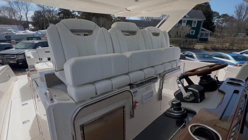 Slide: The Image of 2023 Tiara Yachts 38 LS interior with luxurious seating and modern helm controls. - 14