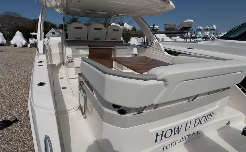 Slide: The Image of 2023 Tiara Yachts 38 LS luxury boat with spacious seating and elegant design. - 3