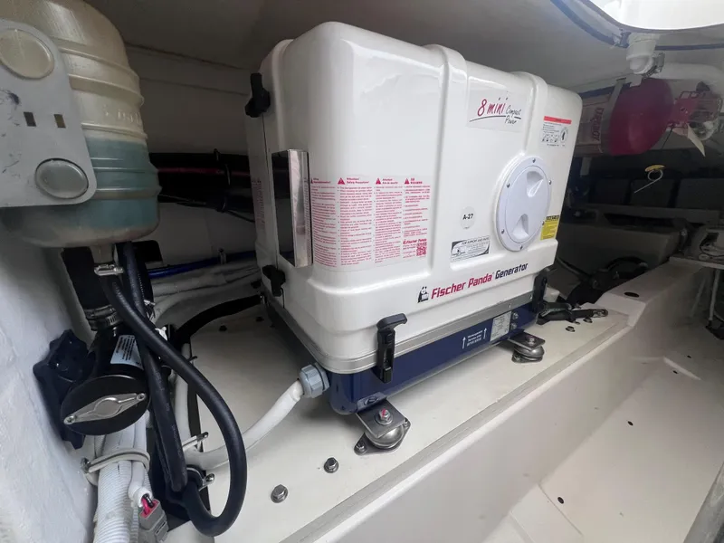 Slide: The Image of Engine room of 2023 Tiara Yachts 38 LS with Fischer Panda generator. - 8