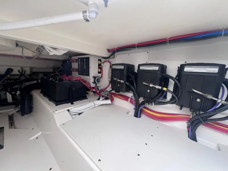 Slide: The Image of Engine compartment of 2023 Tiara Yachts 38 LS, showcasing electrical systems and wiring. - 9