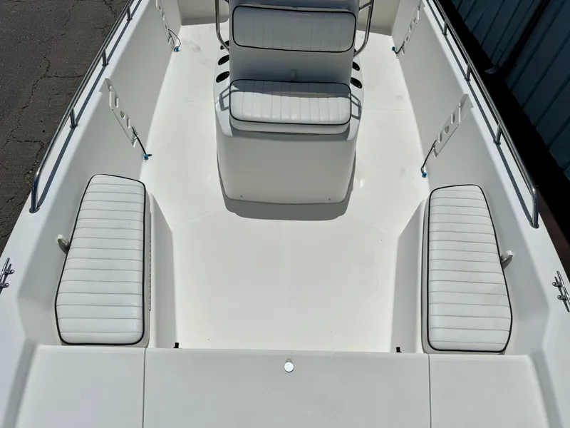 Slide: The Image of Kenner Vision 2102 boat interior, 2001 model, featuring white cushioned seating and sleek design. - 7