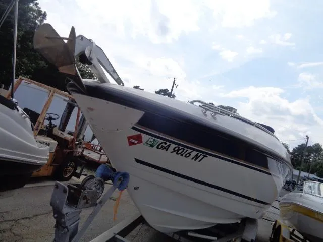 Slide: The Image of 1999 Chaparral 2830 Limited boat on trailer, registration GA 9016 NT, parked outdoors. - 10