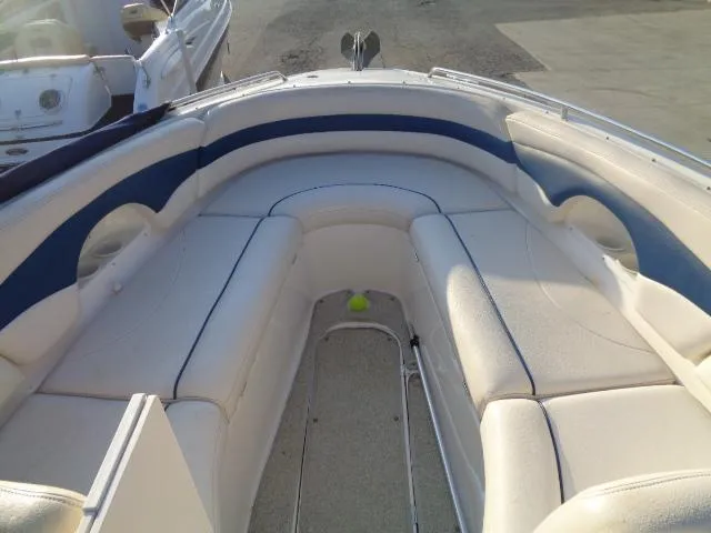 Slide: The Image of 1999 Chaparral 2830 Limited boat interior with white and blue seating. - 12