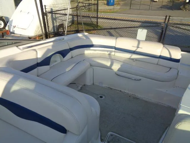 Slide: The Image of 1999 Chaparral 2830 Limited boat interior with white and blue seating. - 2