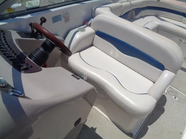 Slide: The Image of 1999 Chaparral 2830 Limited boat interior with white and blue seating. - 3