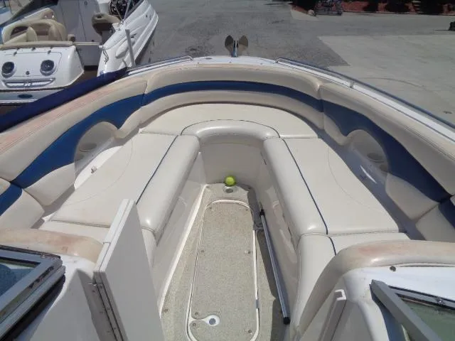 Slide: The Image of 1999 Chaparral 2830 Limited boat interior with white and blue seating. - 4