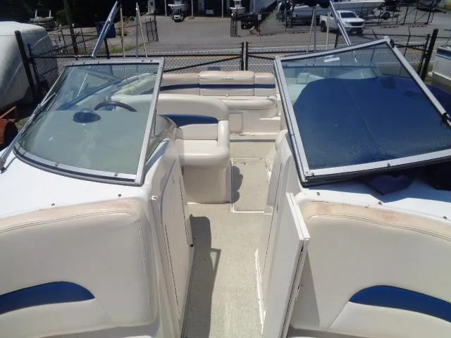 Slide: The Image of 1999 Chaparral 2830 Limited boat interior with seating and windshield. - 5