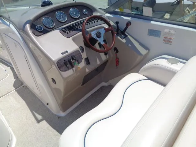 Slide: The Image of 1999 Chaparral 2830 Limited boat dashboard with steering wheel and gauges. - 6