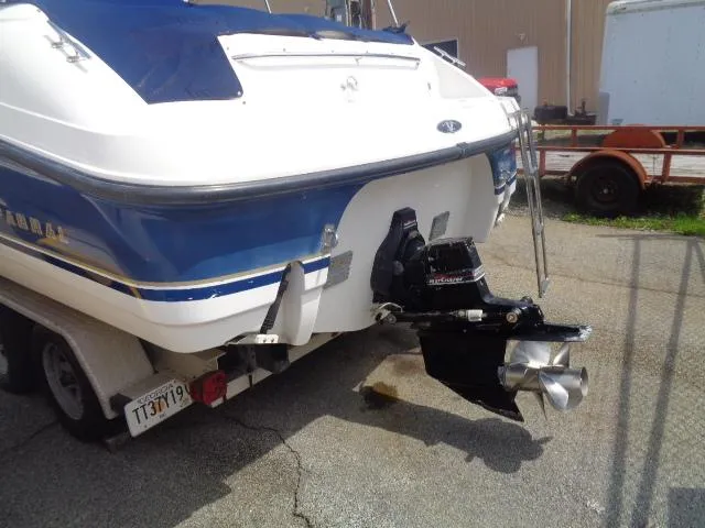 Slide: The Image of 1999 Chaparral 2830 Limited boat rear view with trailer and propeller. - 7