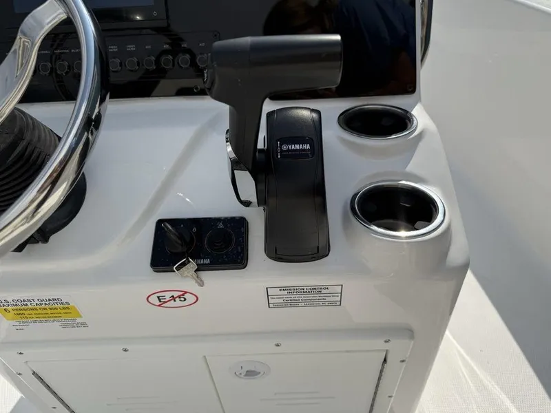 Slide: The Image of 2026 Tidewater 180 CC Adventure boat console with Yamaha controls and cup holders. - 12