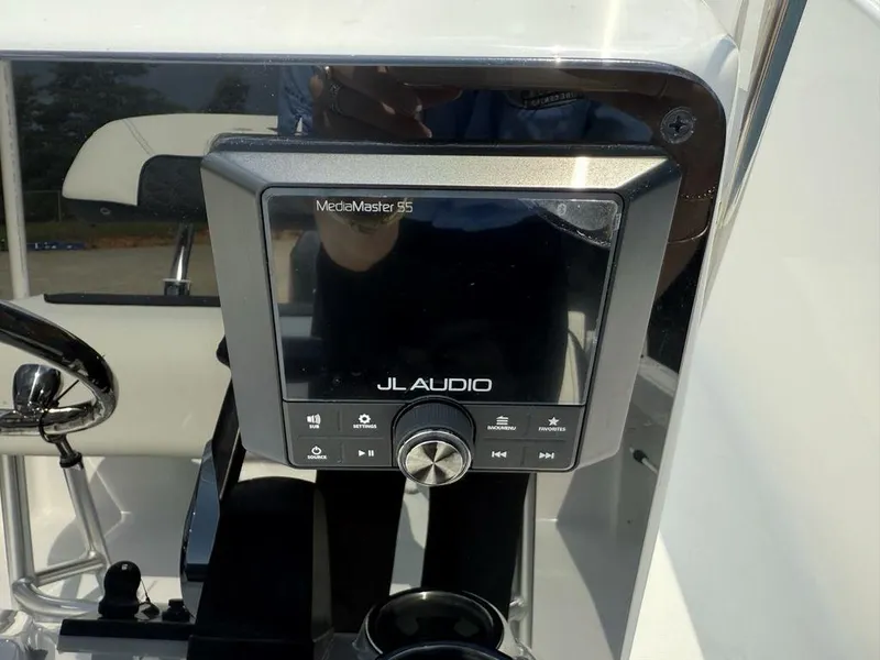 Slide: The Image of JL Audio MediaMaster display on 2026 Tidewater 180 CC Adventure boat dashboard. - 13