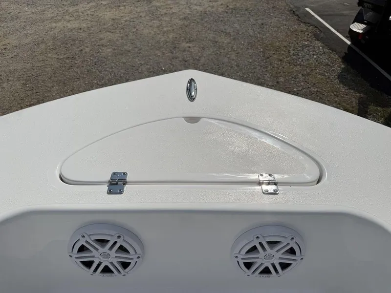 Slide: The Image of 2026 Tidewater 180 CC Adventure boat deck with speakers and storage compartment. - 2