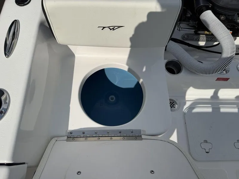 Slide: The Image of 2026 Tidewater 180 CC Adventure boat interior with livewell and storage compartments. - 20
