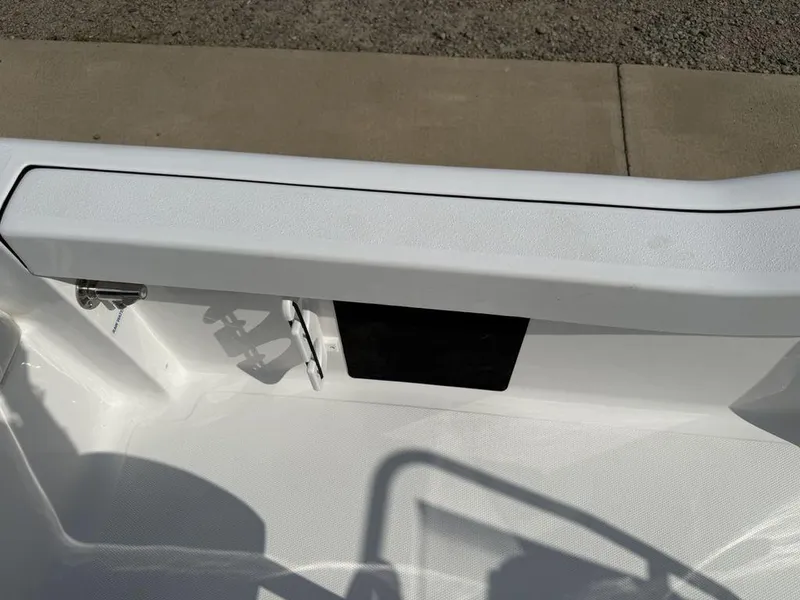 Slide: The Image of 2026 Tidewater 180 CC Adventure boat interior detail, featuring sleek white design and hardware. - 22