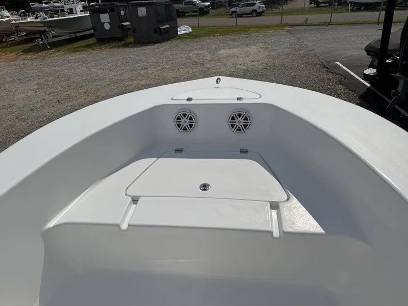 Slide: The Image of 2026 Tidewater 180 CC Adventure boat interior with storage compartment and speakers. - 3