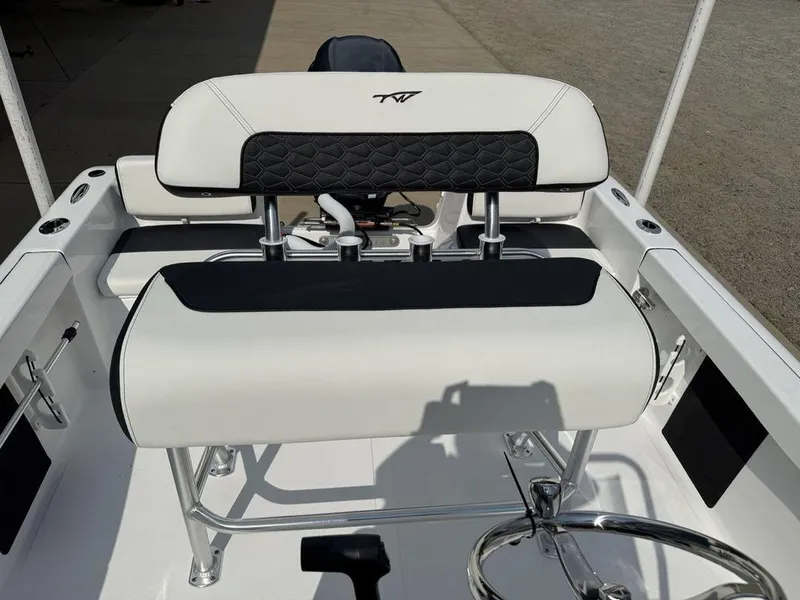 Slide: The Image of 2026 Tidewater 180 CC Adventure boat interior with white and black seating. - 6