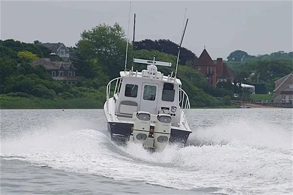 Slide: The Image of 2026 Steiger Craft 31 Miami boat cruising on a scenic waterway. - 10