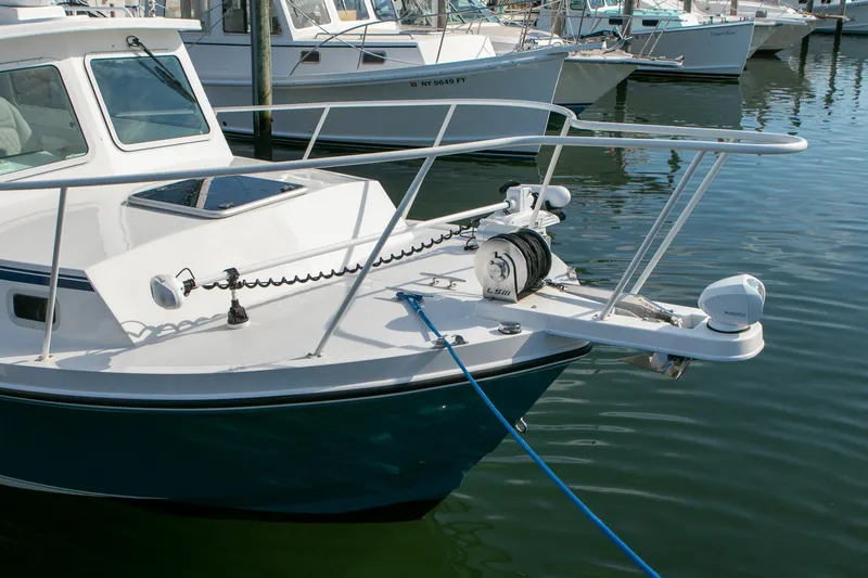 Slide: The Image of 2026 Steiger Craft 31 Miami boat docked, featuring a sleek bow design and modern equipment. - 16