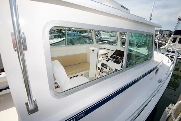 Slide: The Image of 2026 Steiger Craft 31 Miami boat interior with modern controls and seating. - 22