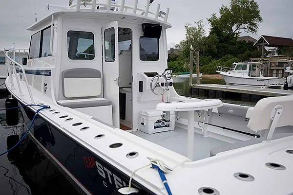 Slide: The Image of 2026 Steiger Craft 31 Miami boat docked, featuring spacious deck and modern design. - 23