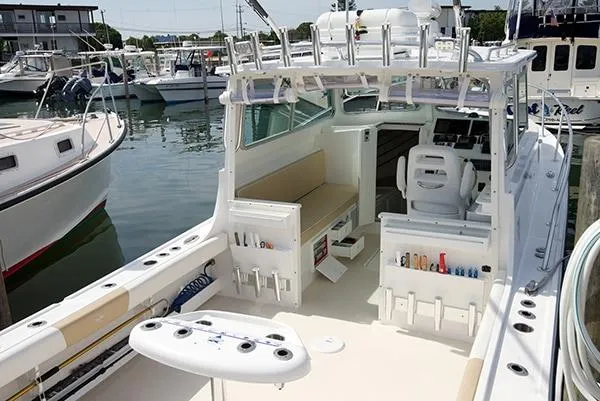 Slide: The Image of 2026 Steiger Craft 31 Miami boat with fishing gear, docked at a marina. - 24