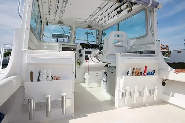 Slide: The Image of Interior of 2026 Steiger Craft 31 Miami boat, featuring fishing rod holders and storage compartments. - 27