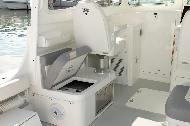 Slide: The Image of 2026 Steiger Craft 31 Miami boat interior with seating and storage compartments. - 29