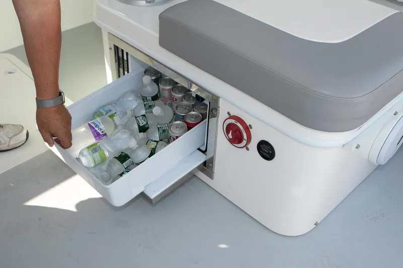 Slide: The Image of Built-in cooler drawer on 2026 Steiger Craft 31 Miami boat, stocked with drinks. - 41