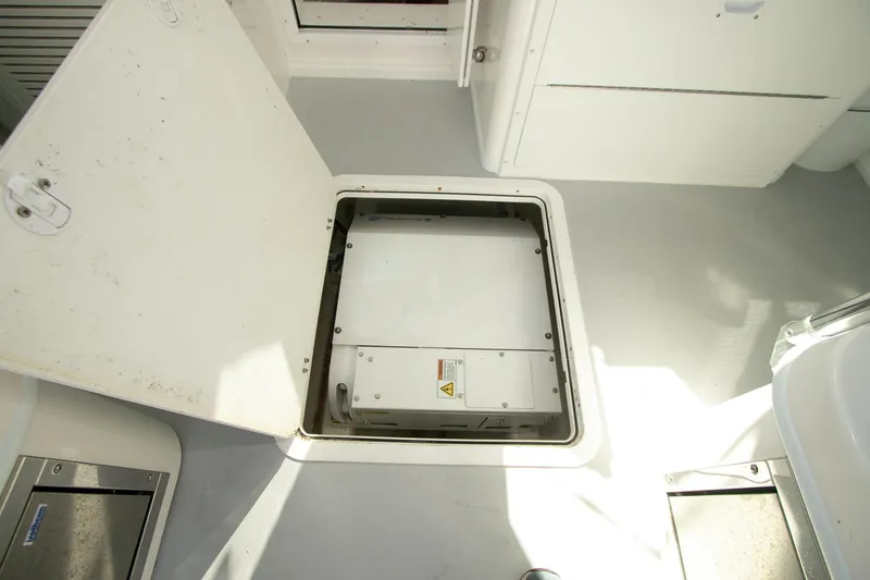 Slide: The Image of Open hatch on 2026 Steiger Craft 31 Miami boat, revealing interior compartment. - 42